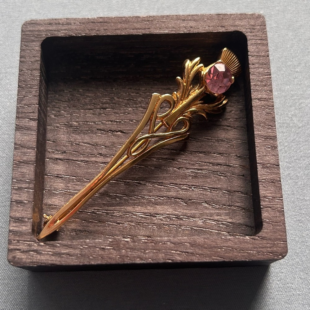3/$10 Gold Tone Brooch With Purple Rhinestone